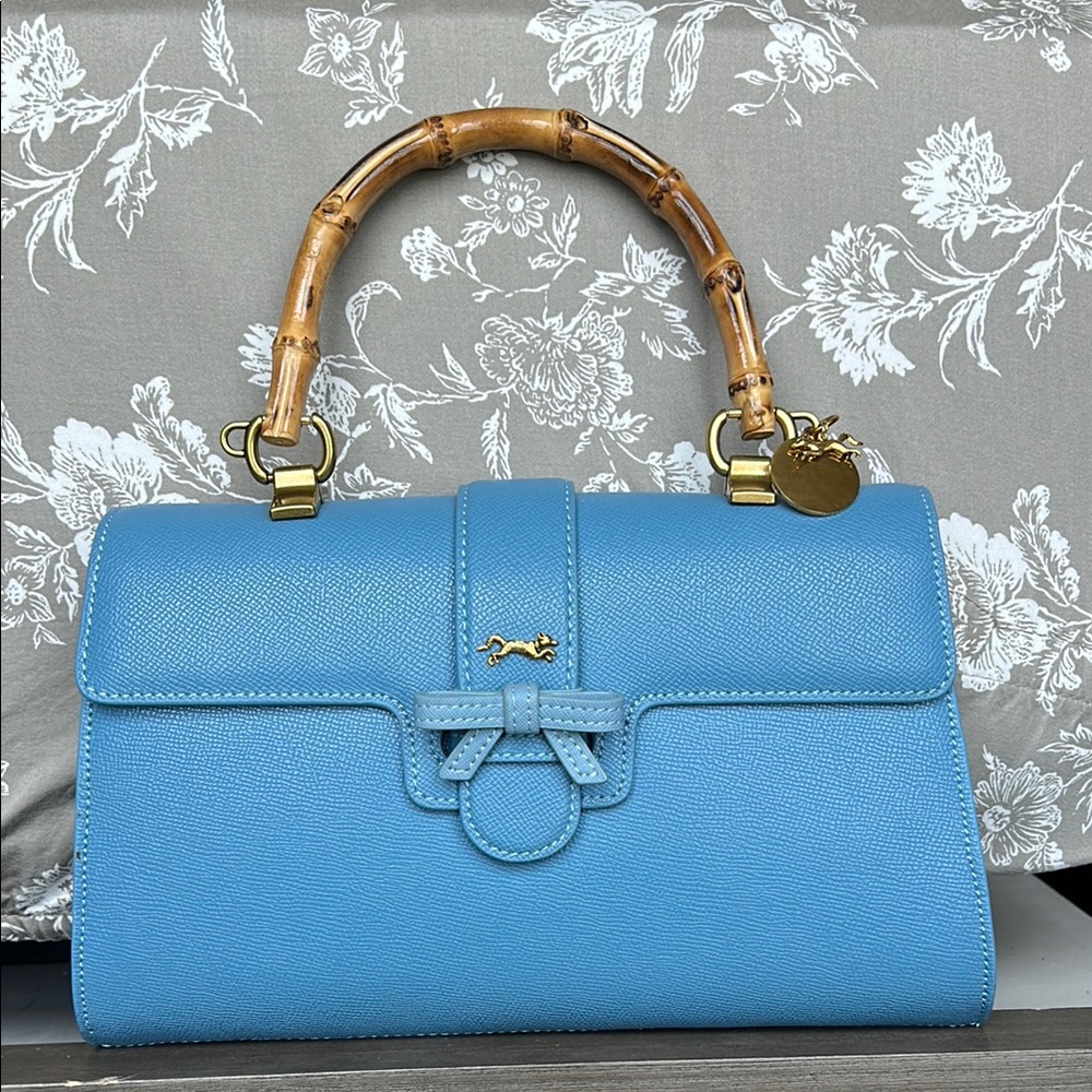 MME. MINK BLUE TOP HANDLE CARLTON BOW BAG